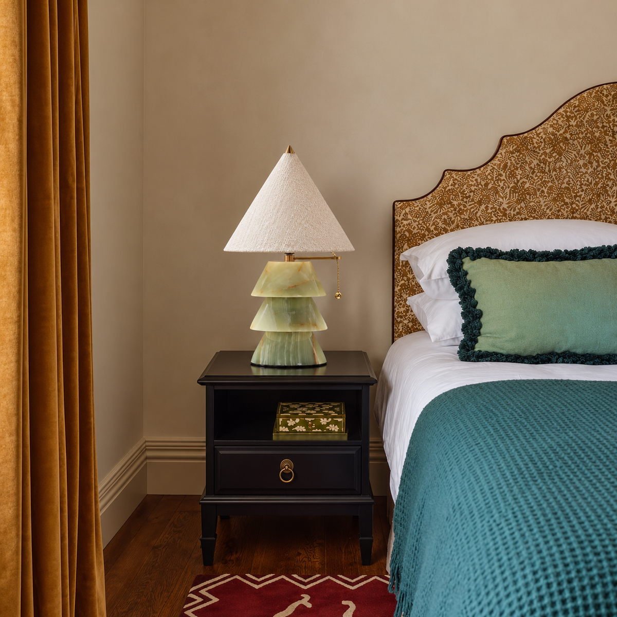 Pagoda jade-green table lamp on a bedside table