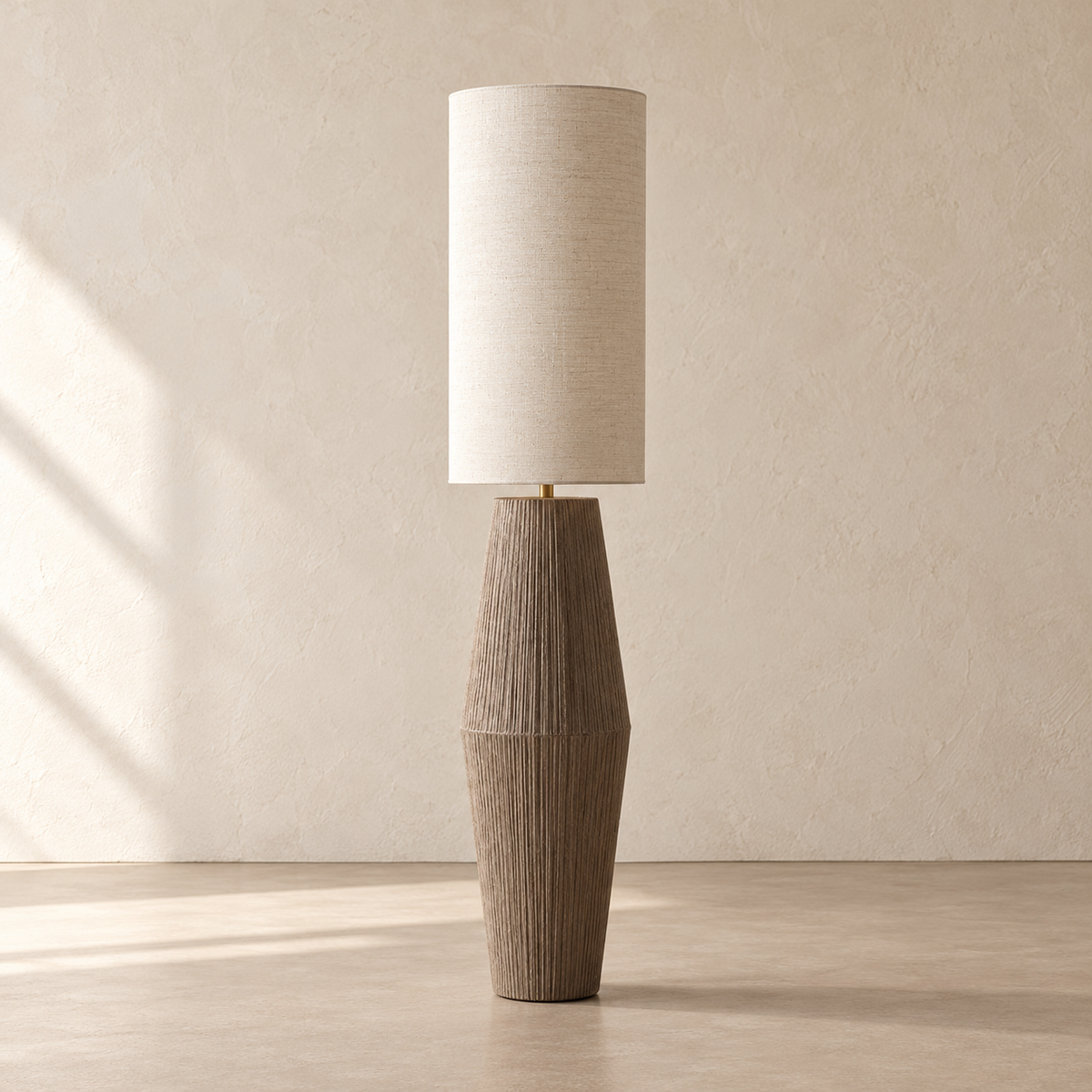 Palestrina floor lamp unlit, with a tall linen shade and tapered textured base on a beige background.