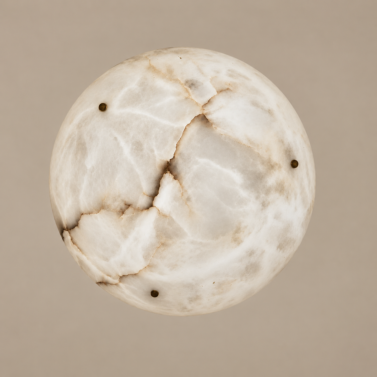 Underside of the alabaster bowl showing natural mineral bands and three brass fixing knobs.