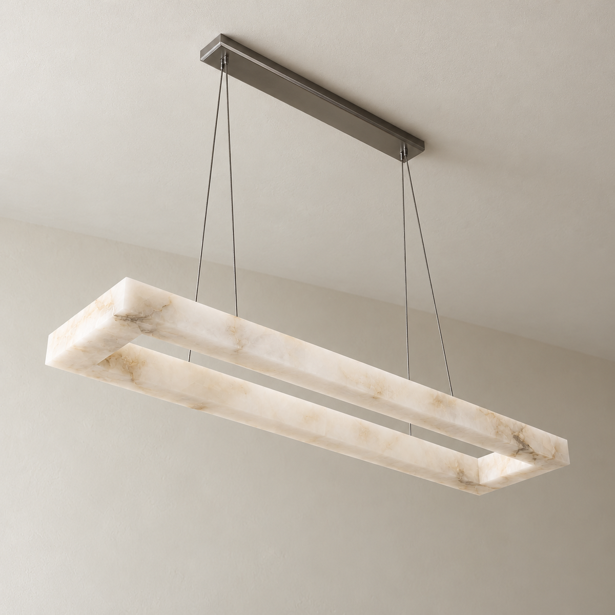 Rectangular alabaster chandelier unlit with black suspension hardware.