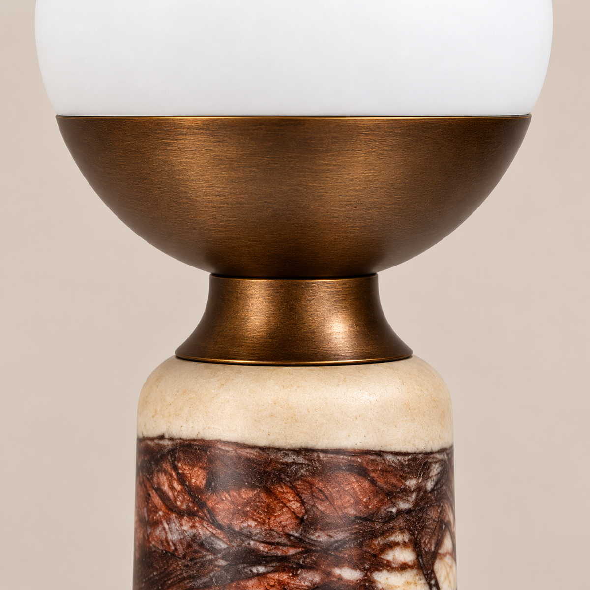 Close view of the red marble column, bronze collar and opaline glass.