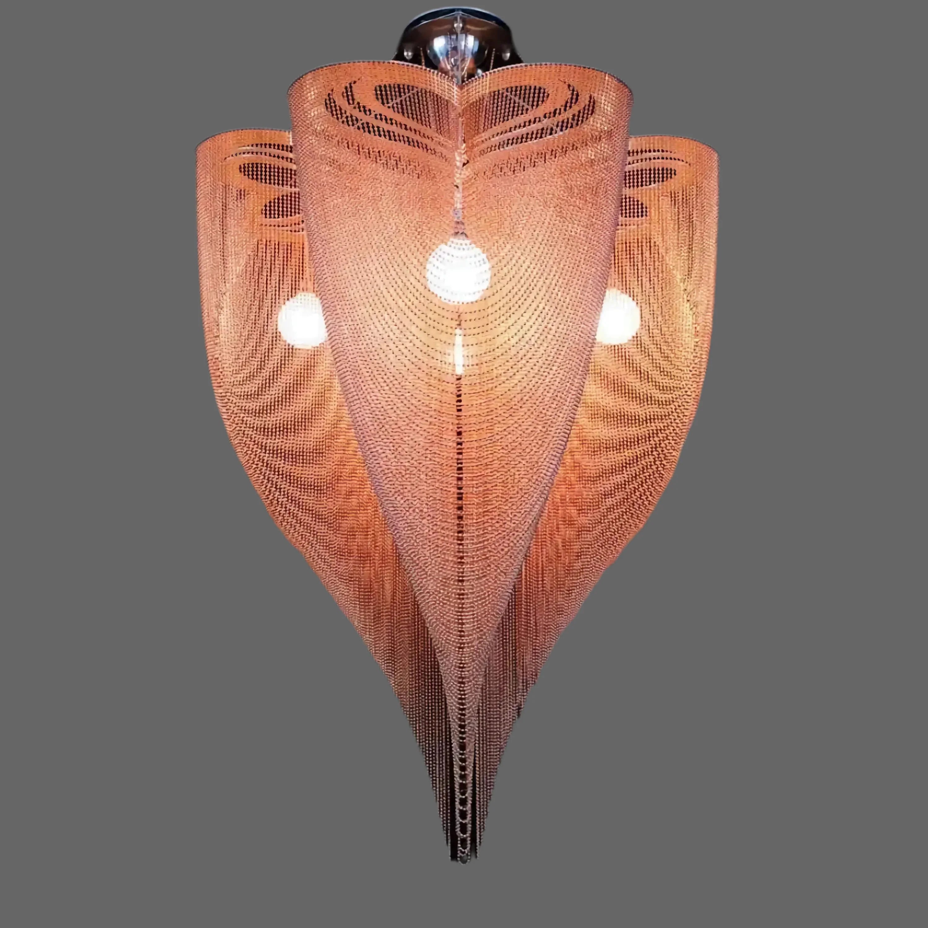Rose gold mesh chandelier glowing warm