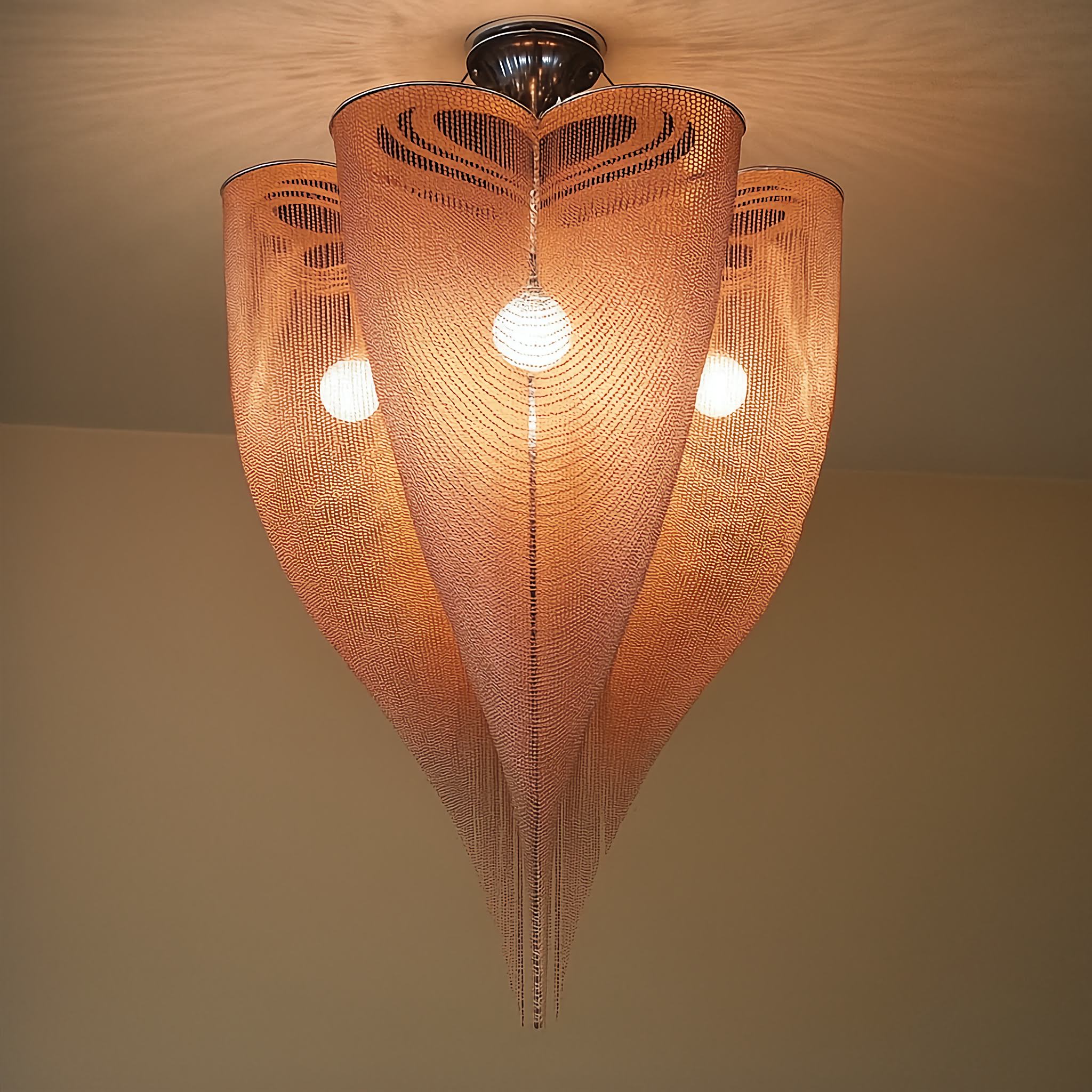 Rose gold mesh chandelier in a living room