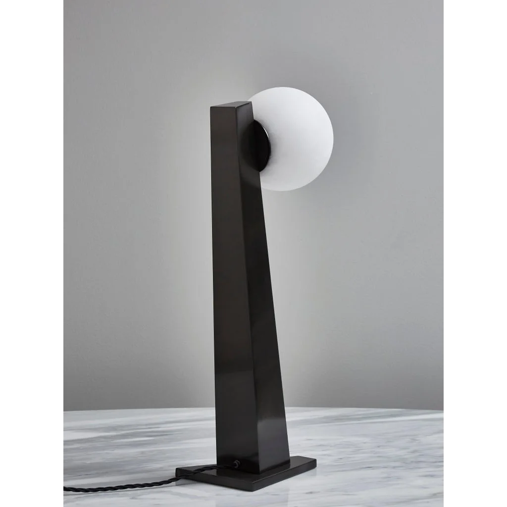 Globe table lamp in a library