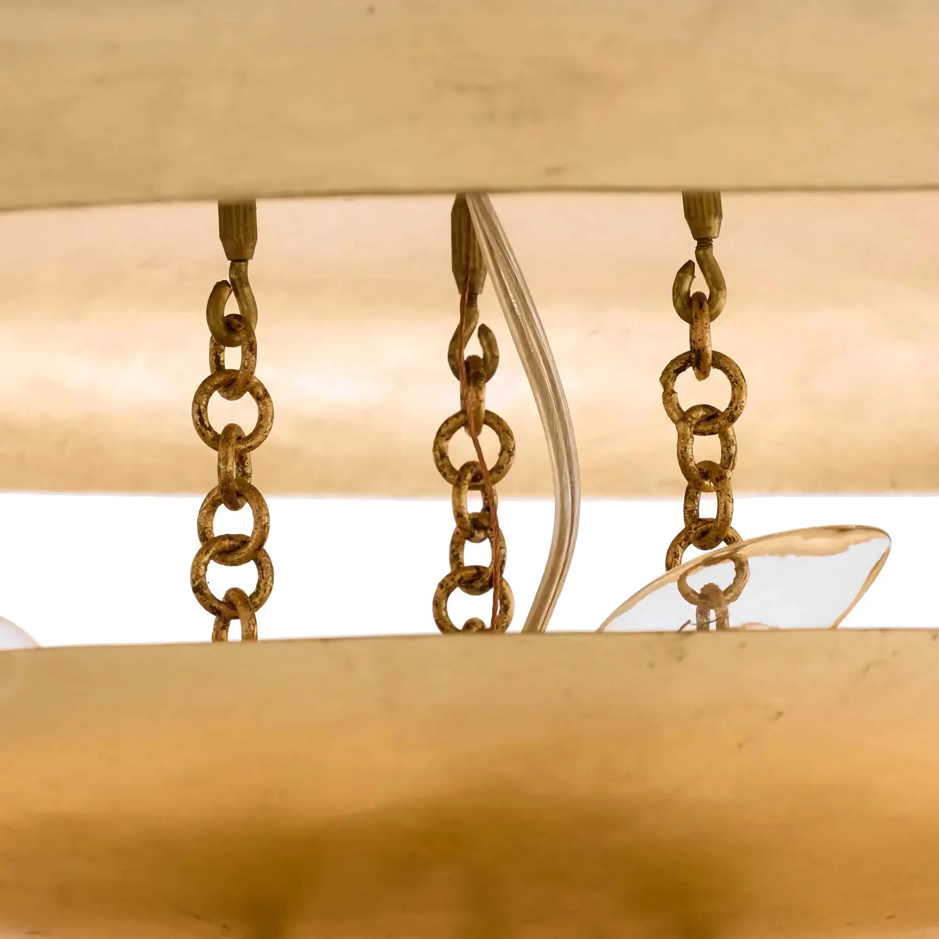 Sculptural tiered pendant glowing warm