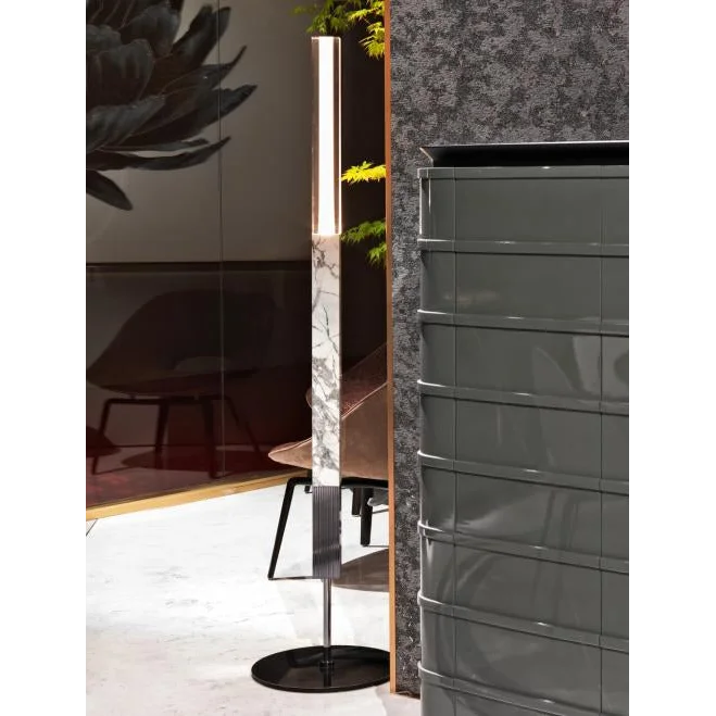 Marble torchiere casting a soft upward wash