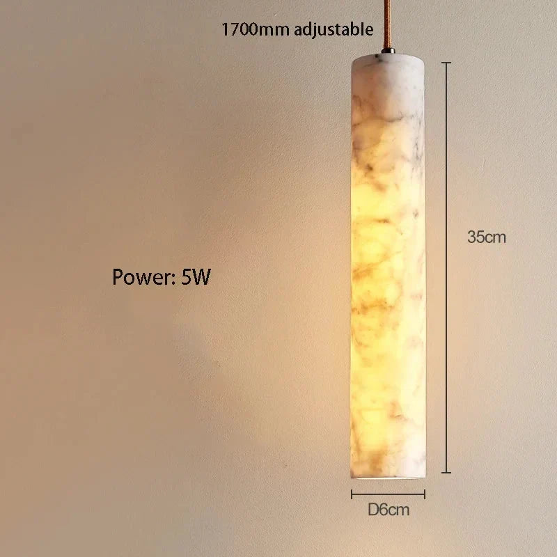 Slim Stone pendant dimensions: 35 cm high, 6 cm diameter, with an adjustable suspension cable.