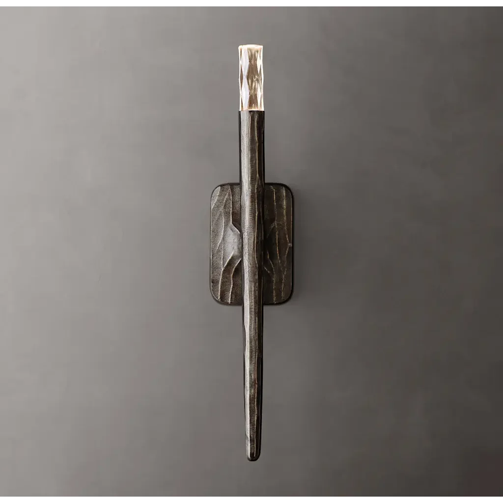 Tapered silver copper rod with a glowing crystal tip