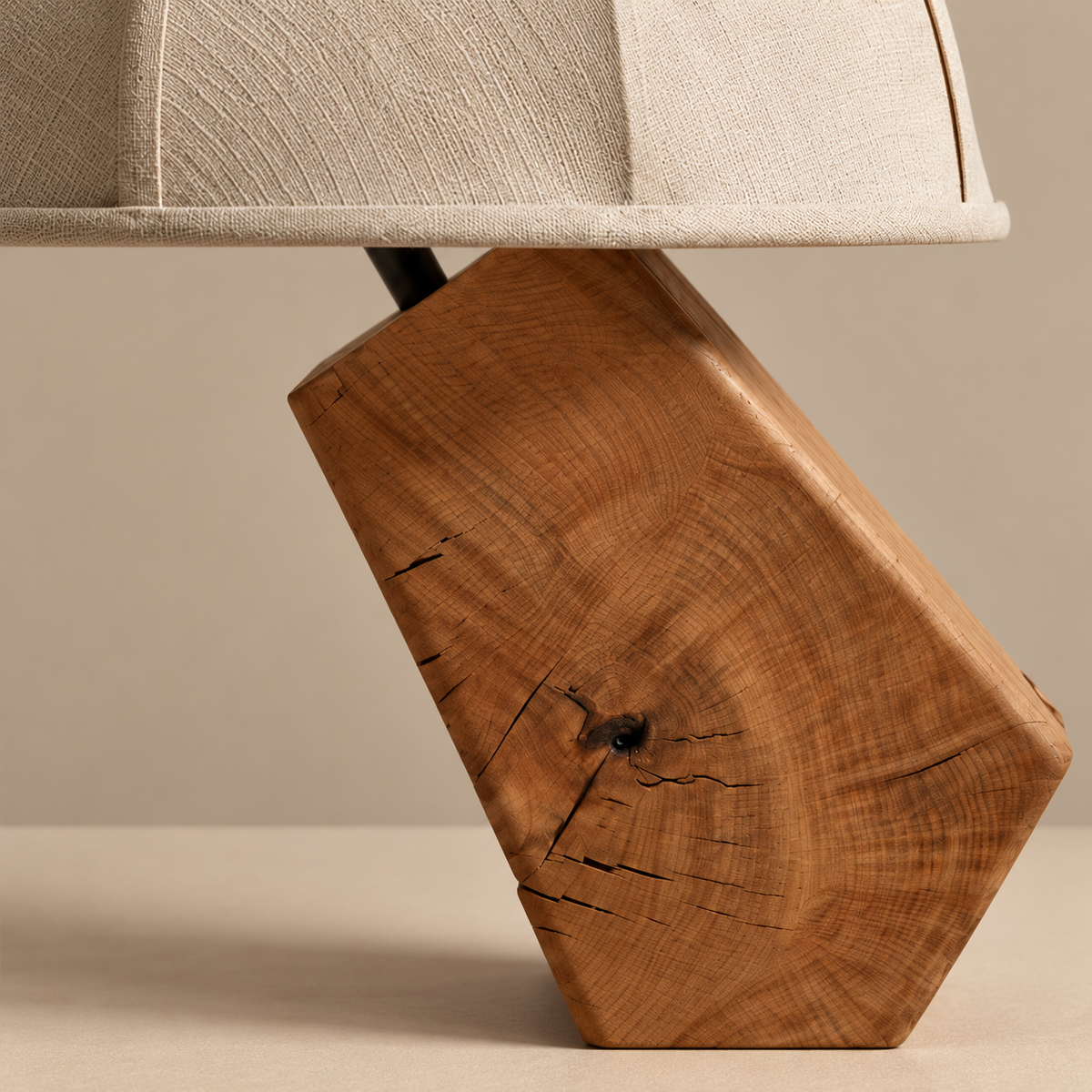 Natural wood grain and angled foot of the Tanaka table lamp