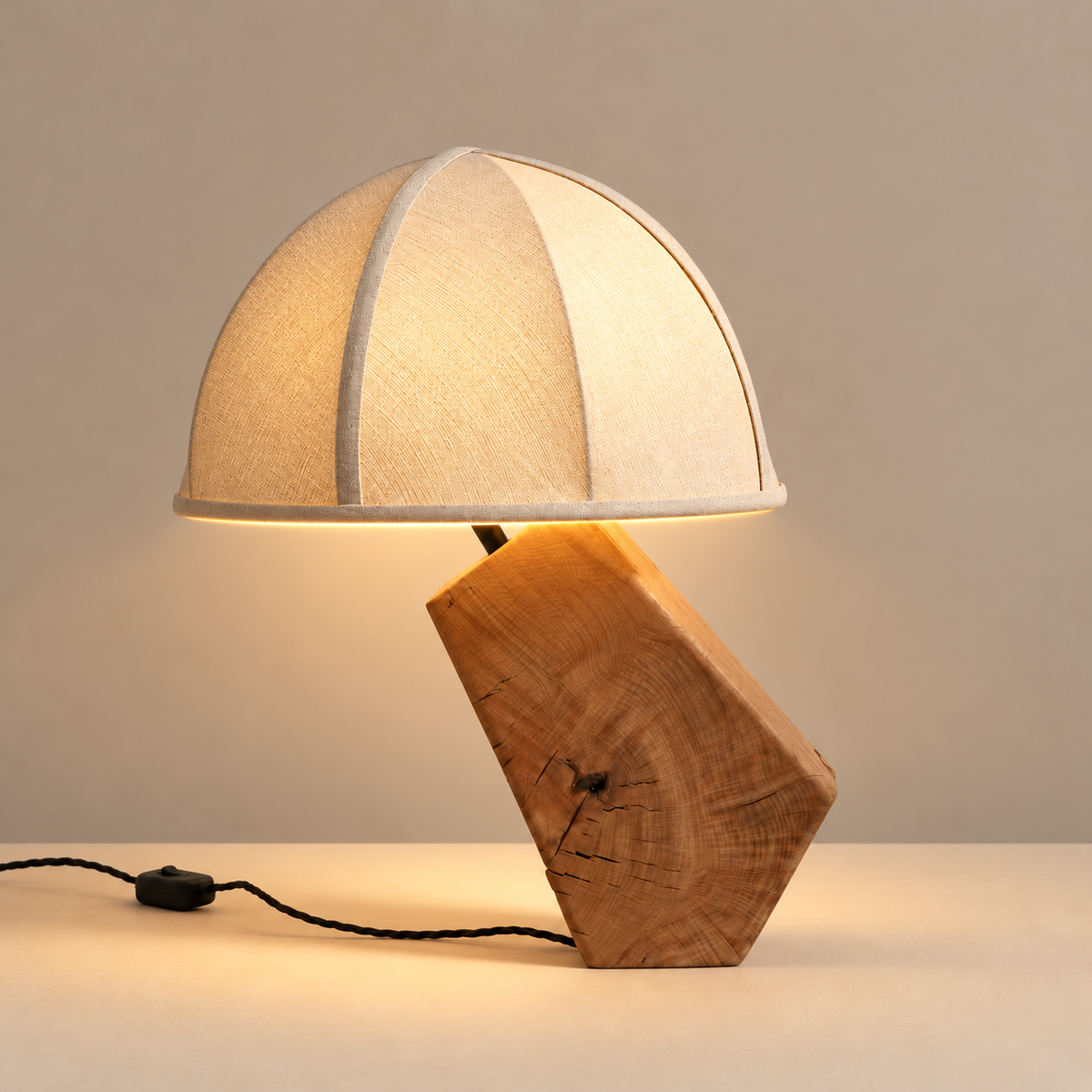 Tanaka timber table lamp illuminated on a beige background