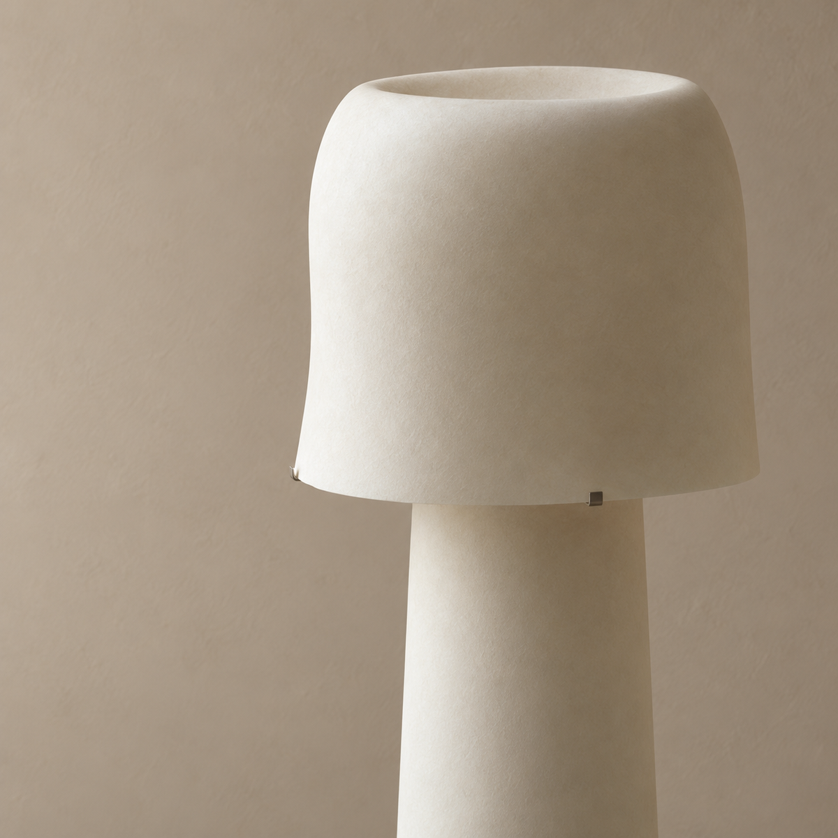Close view of Tibur’s washi-textured resin shade, open top and metal support clips