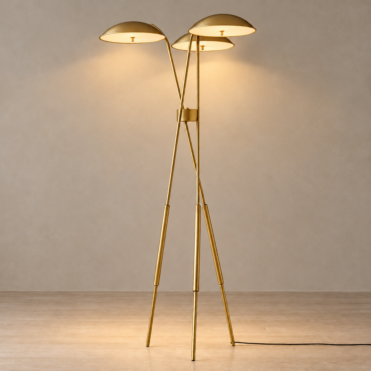 Trilume floor lamp illuminated, with three softly glowing shades on its copper tripod.