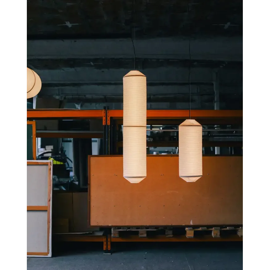 Japandi-minimalist rice-paper column light in a bedroom
