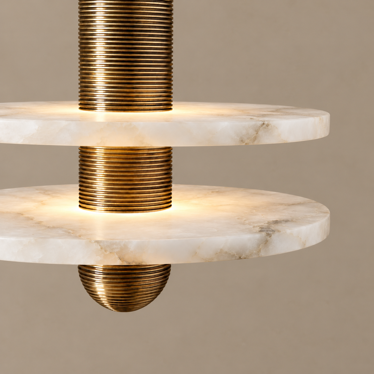 Natural cloudy alabaster discs around Volto’s ribbed brass column