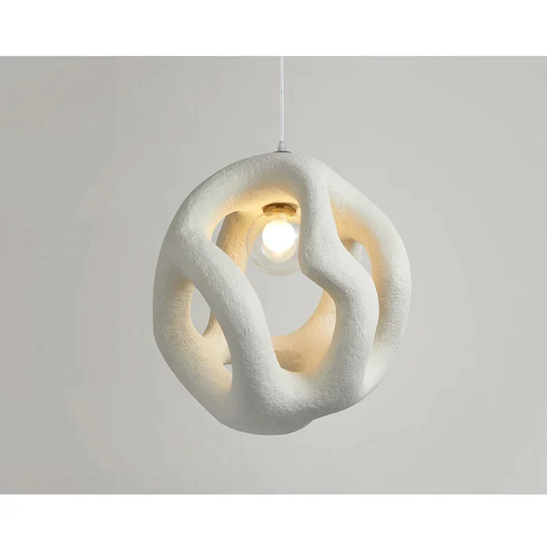 Hand-cast resin pendant over a table