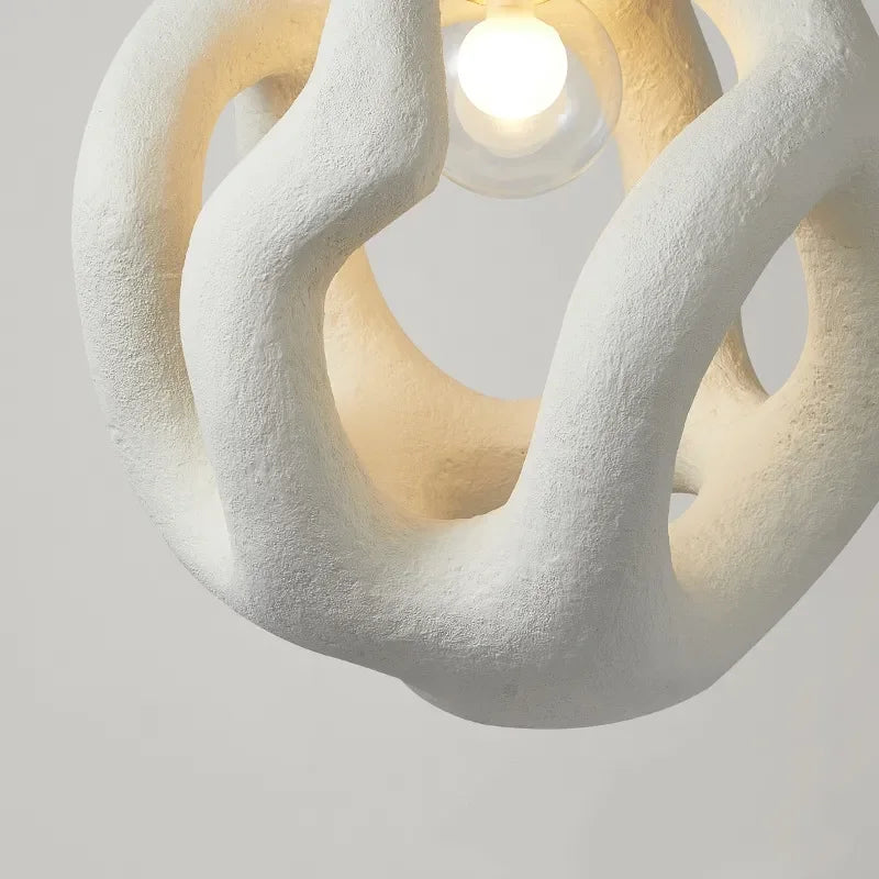 Flowing resin pendant light in a bedroom