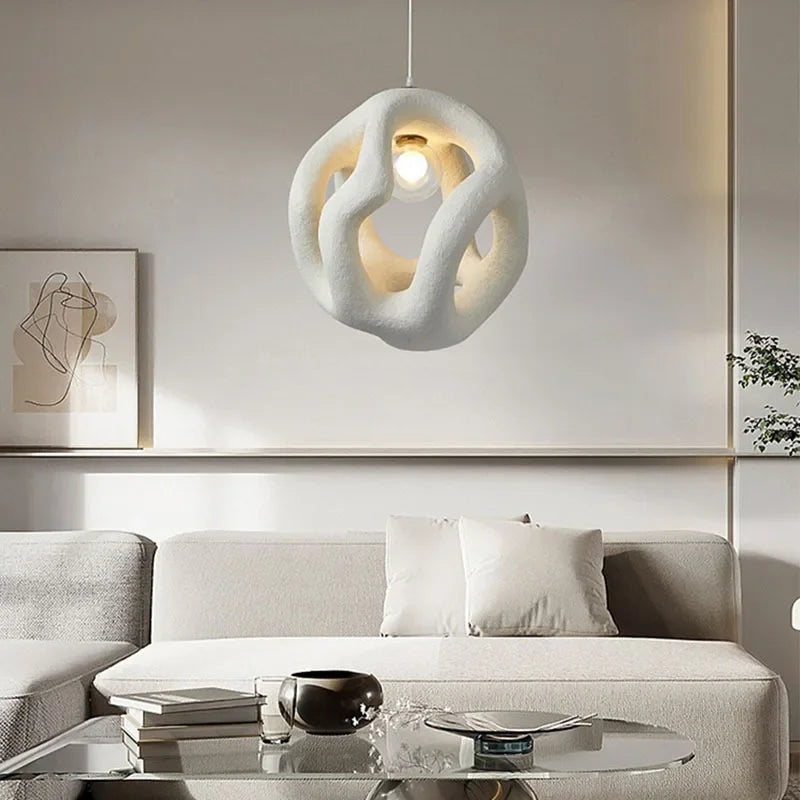 Resin pendant playing light and shadow in an entryway