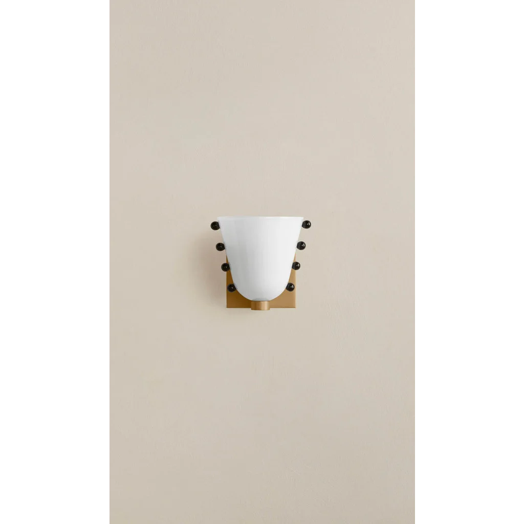 Black stud and brass mount detail