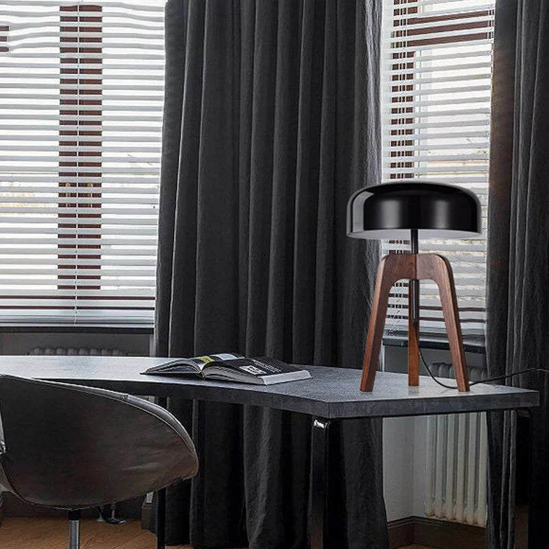 Wood tripod table lamp on a side table
