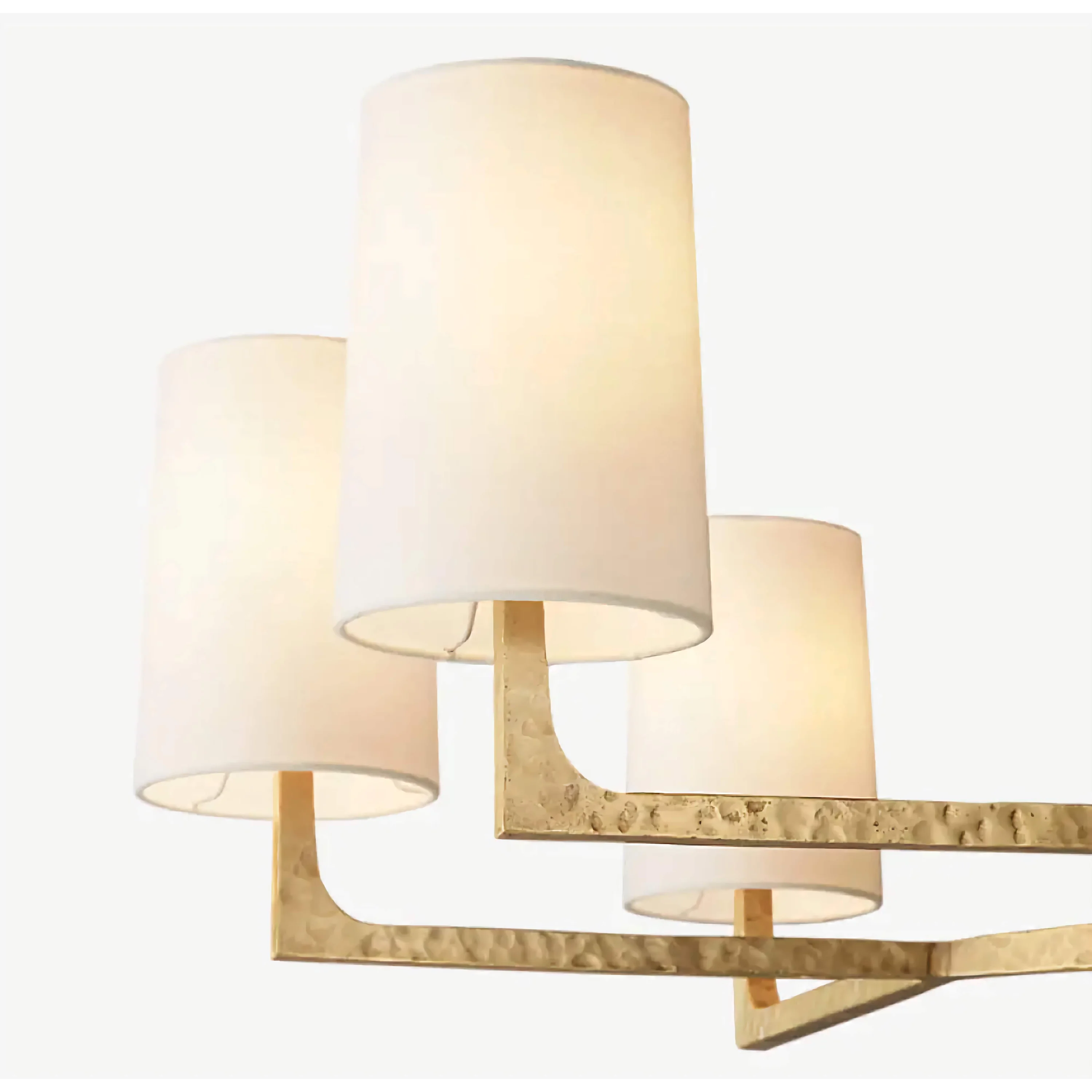 Copper and linen chandelier over a dining table