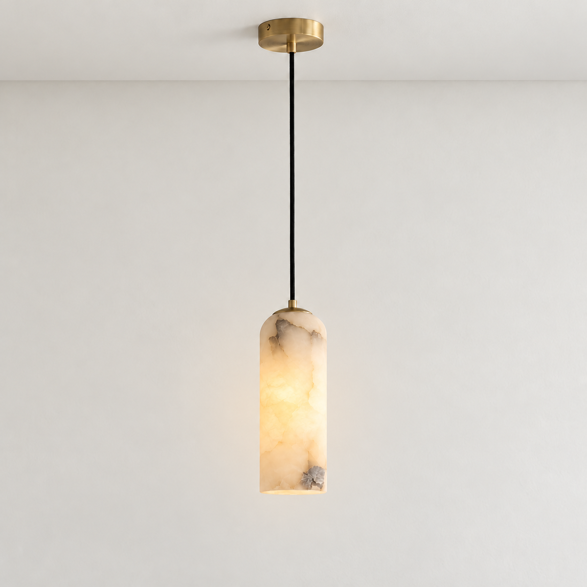 Alabaster column pendant lit from within, with natural grey inclusions and cloudy stone.