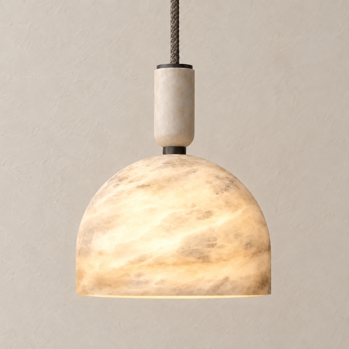 Illuminated alabaster dome pendant with natural layered mineral texture.