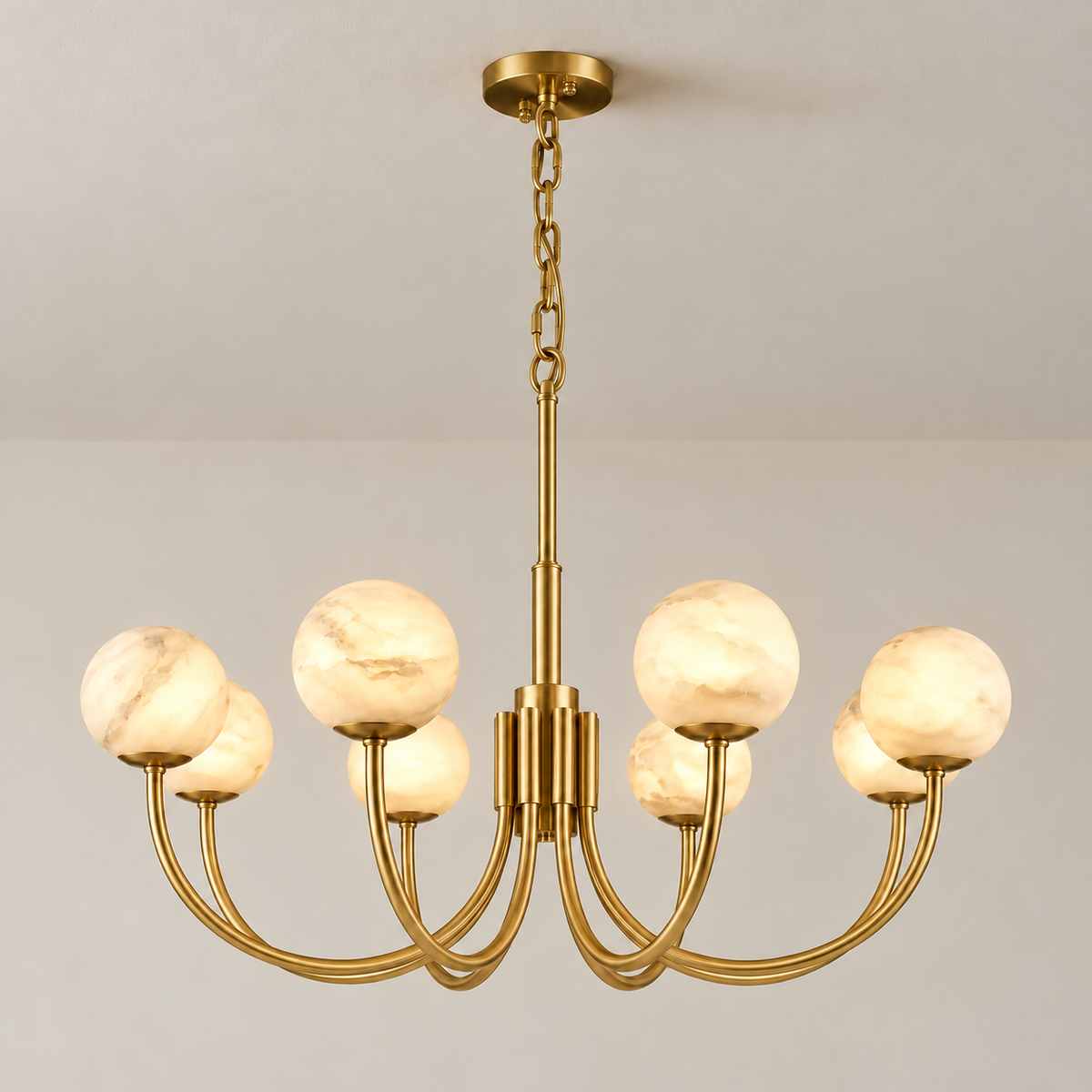 Eight alabaster globes illuminated on a brass chandelier, with natural mineral clouds visible.