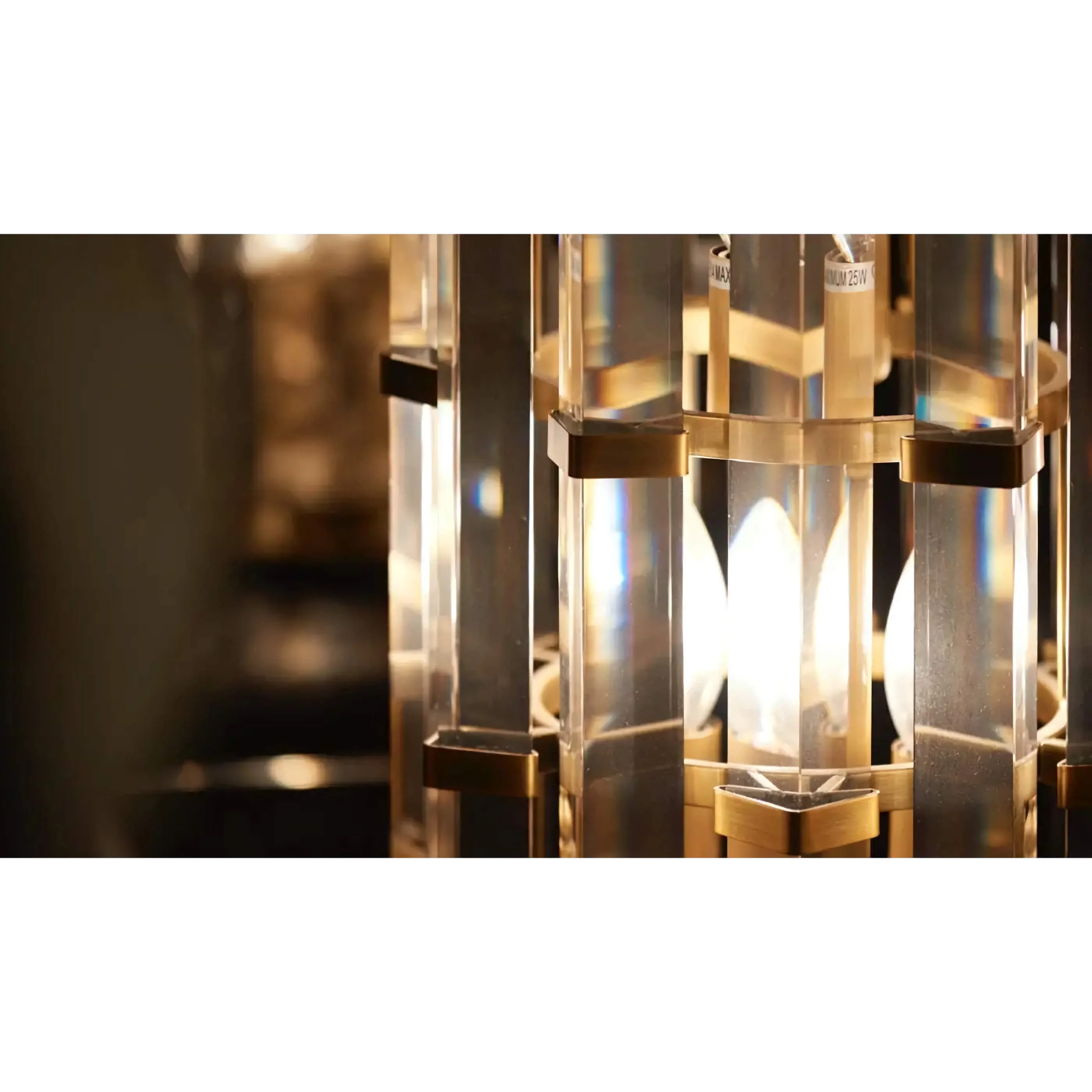 Amber K9 crystal rods on a gold copper column refracting warm light