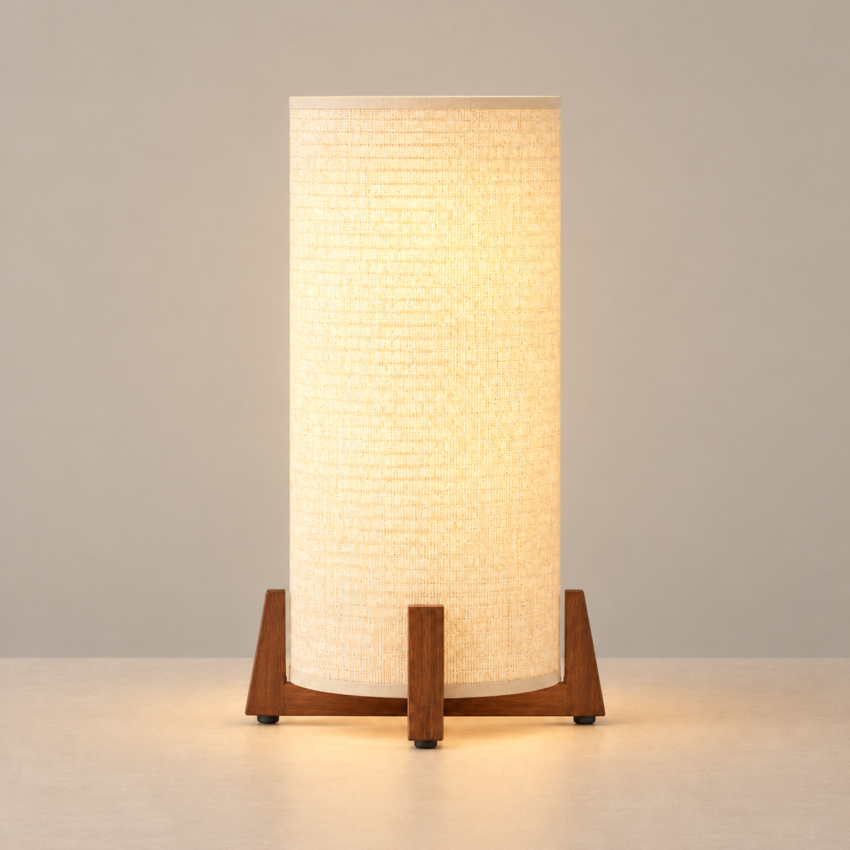 Bamboo and Walnut table lamp illuminated on a beige background