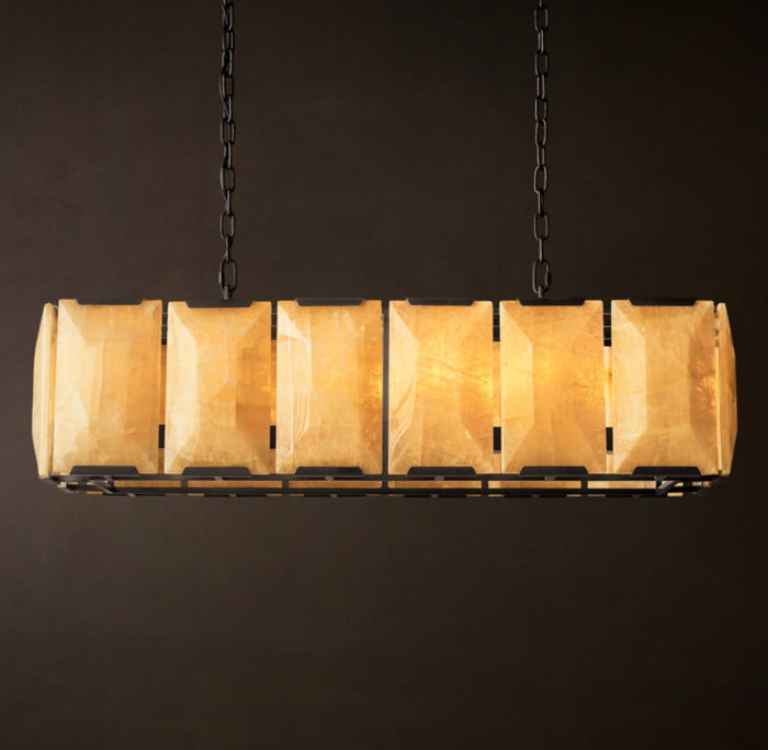 Alabaster veining lit warm against the cool black frame