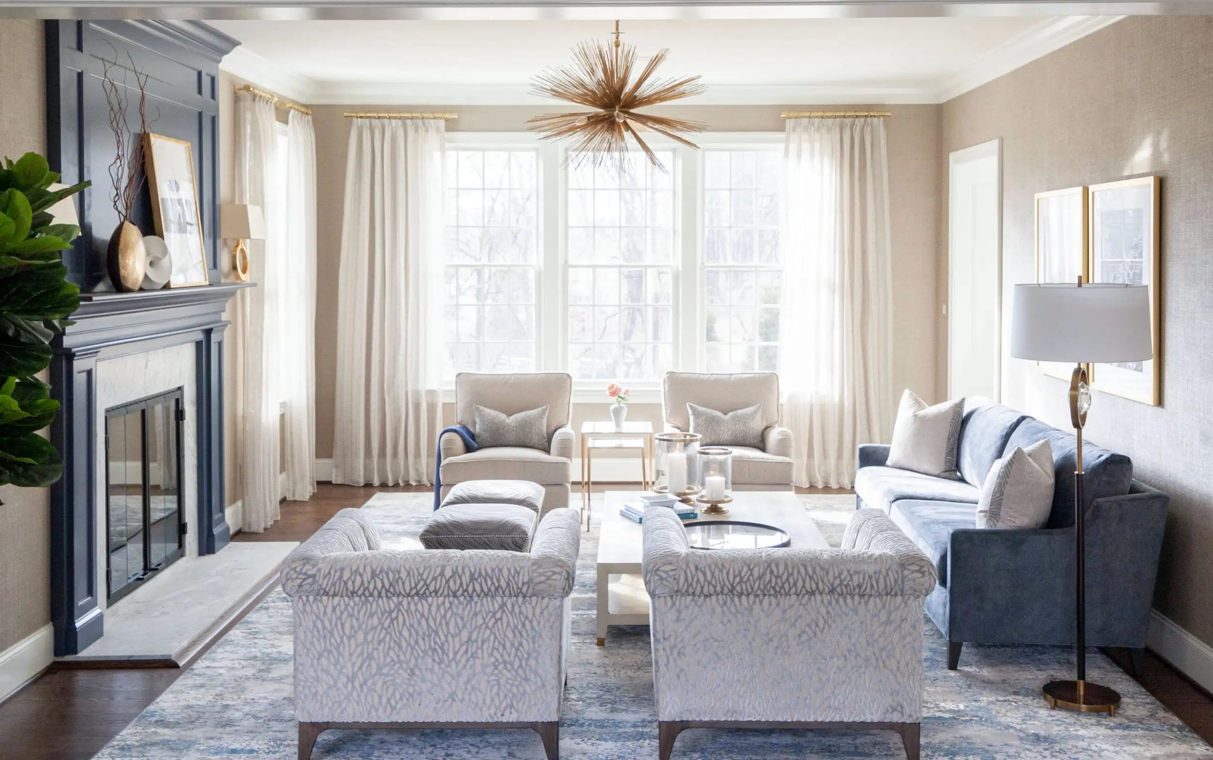 Blue upholstered sofa with matching throw pillows and a tufted backrest.