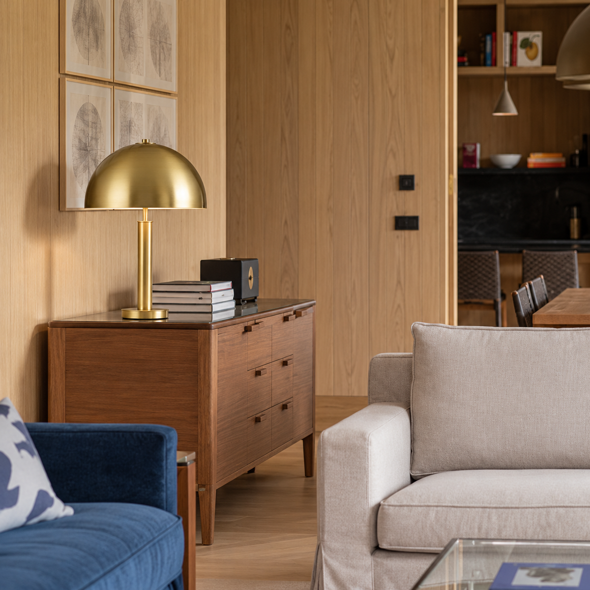 Dome Table Lamp on a walnut chest in a living room.