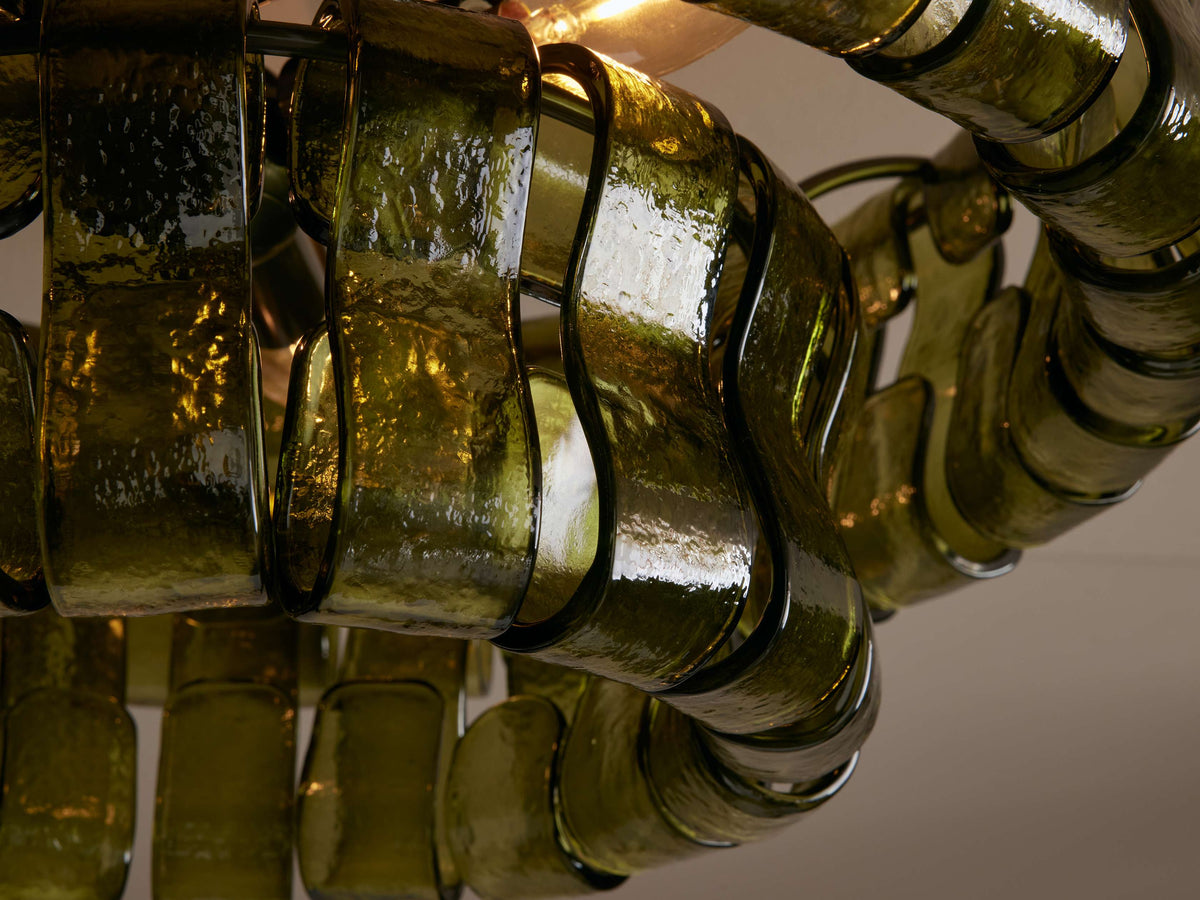 Close-up of the curved textured green glass panels of the Bellatrix semi-flush mount