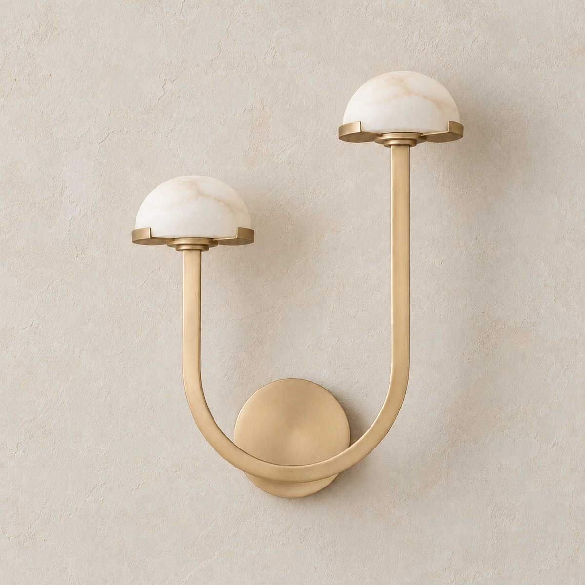 Unlit double alabaster dome wall sconce with the taller brass arm on the right.