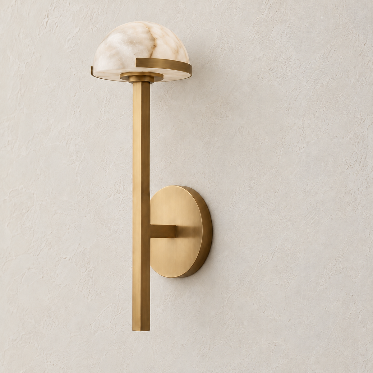 Brass and alabaster dome wall sconce, switched off on ivory plaster.