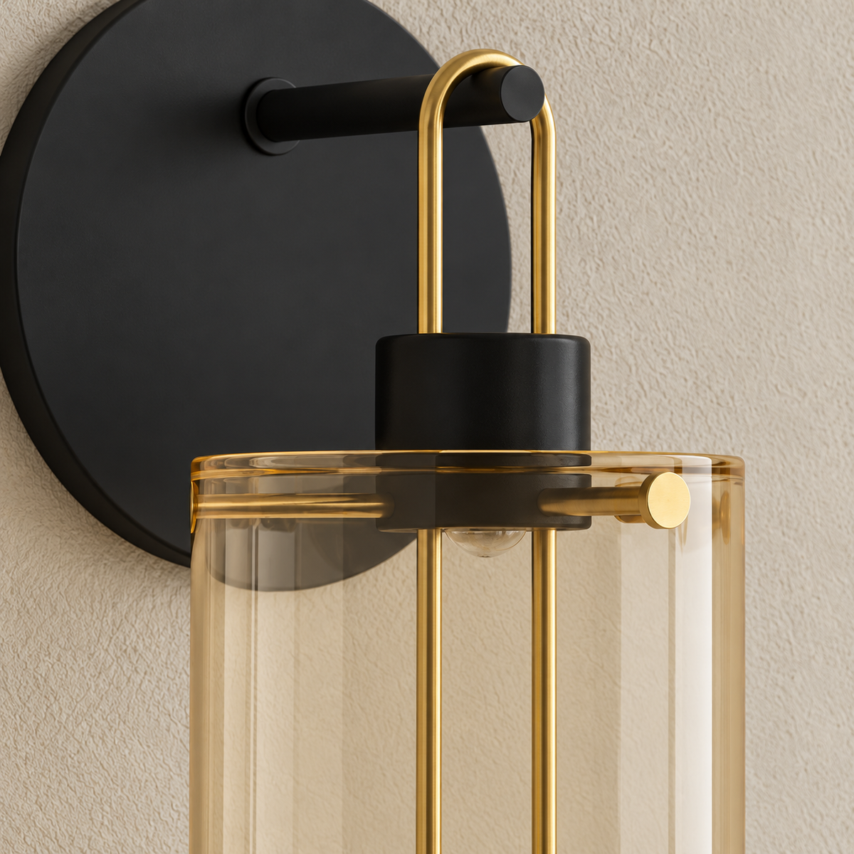 Detail of the amber glass shade, brass loop and black socket.