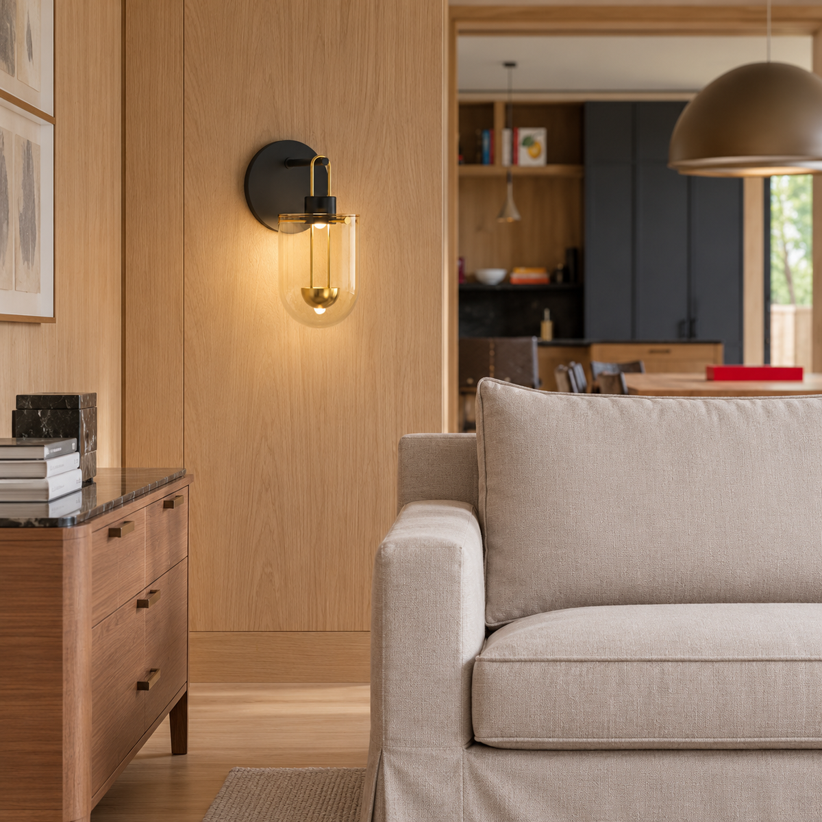 Amber glass sconce installed on an oak-panelled living room wall.