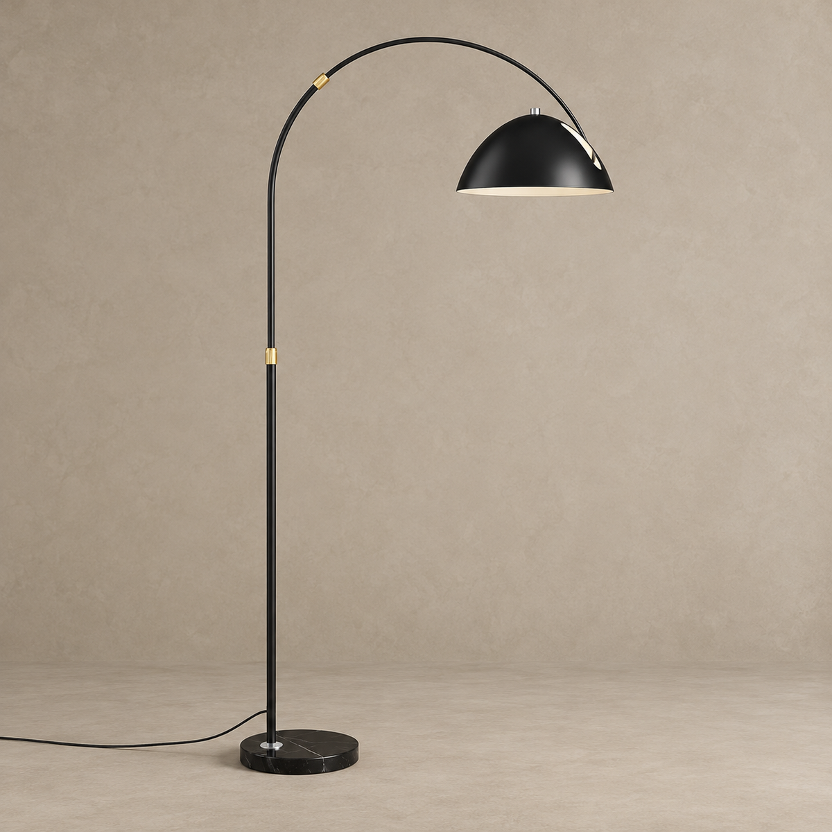 Black CL55124 arc floor lamp switched off, with gold adjustment collars and a black marble base.