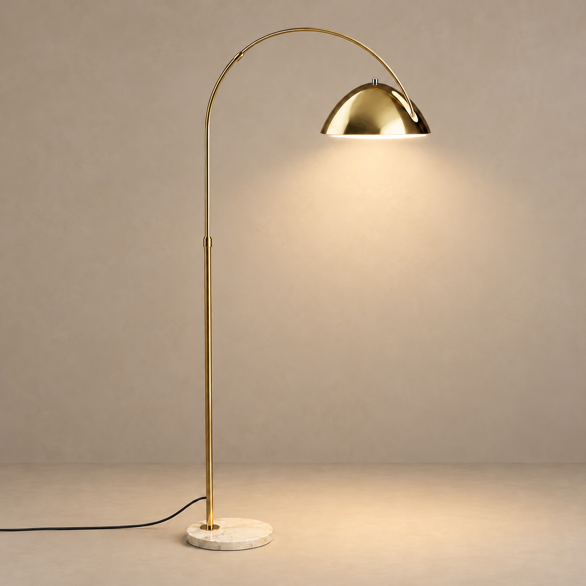 Gold CL55124 arc floor lamp lit, casting light downward from its metal dome.
