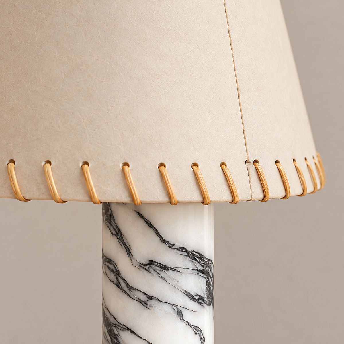 Stitched parchment shade edge and veined marble column