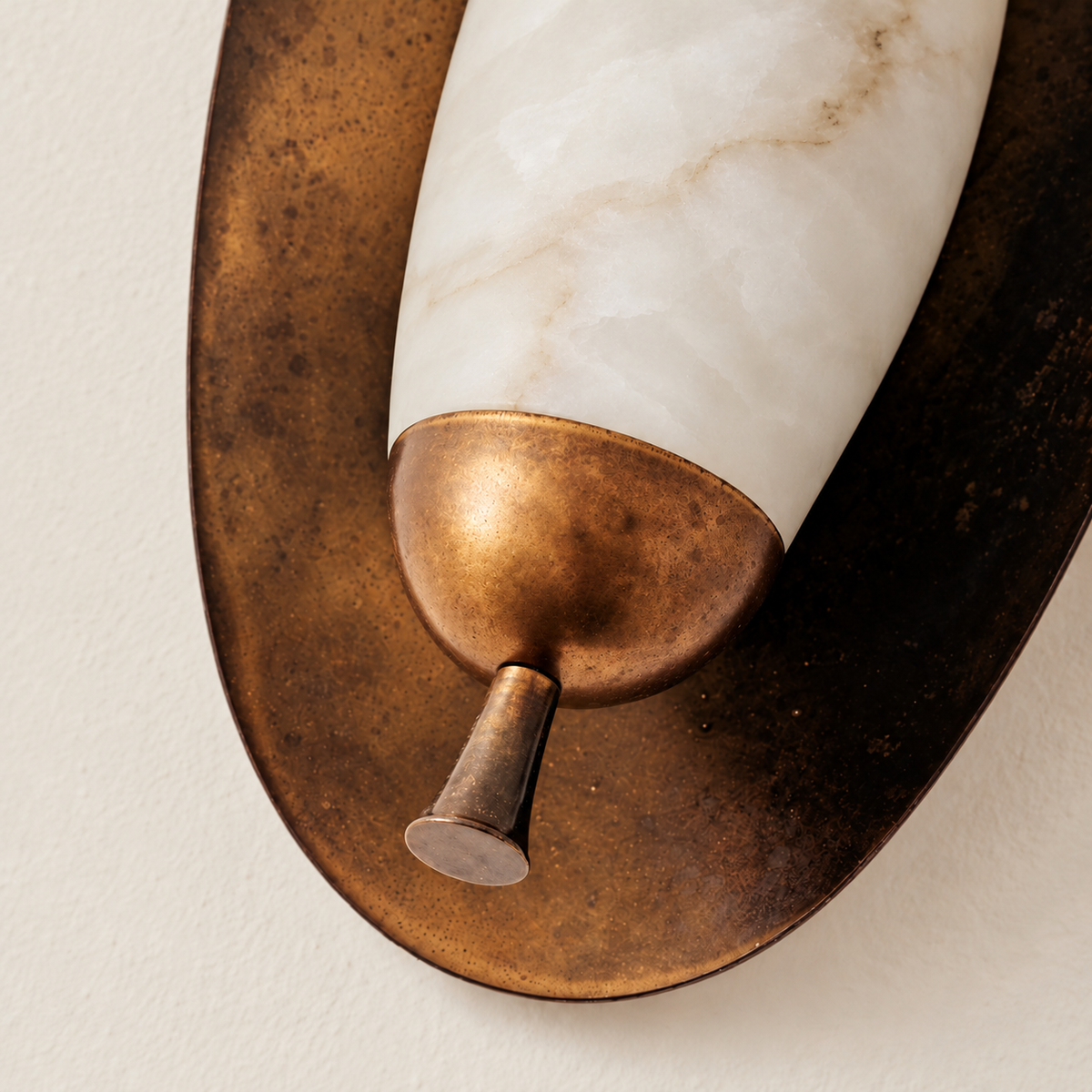 Close detail of the CLASYH87 aged brass cup and tapered finial below its alabaster shade.
