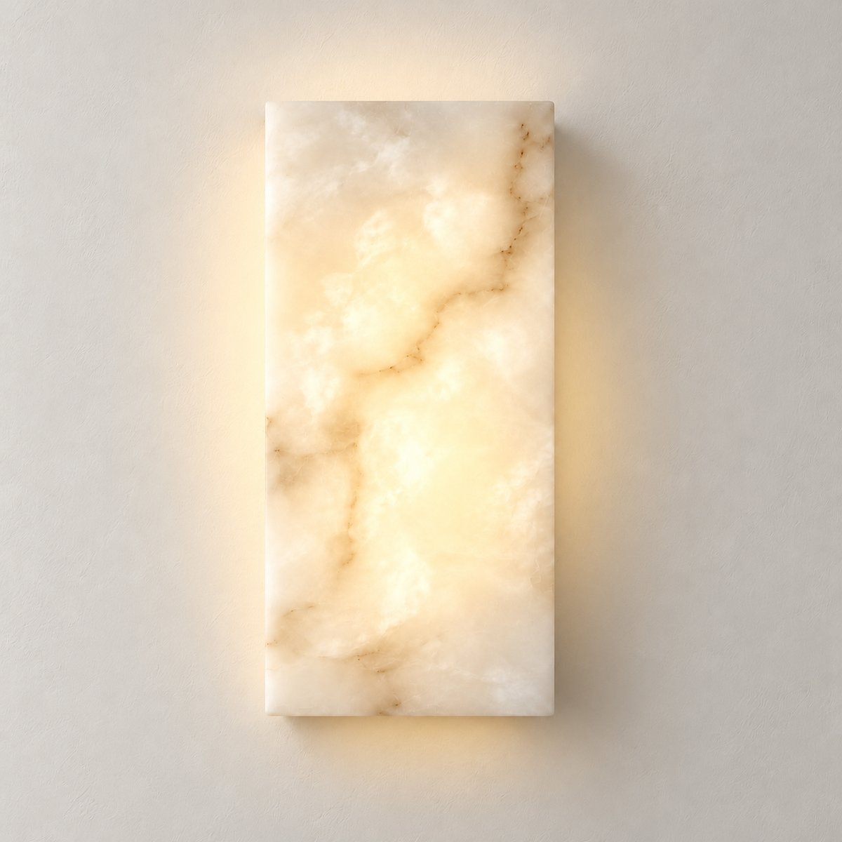Small CLAW025 alabaster wall lamp lit, showing its cloudy stone and natural mineral markings.