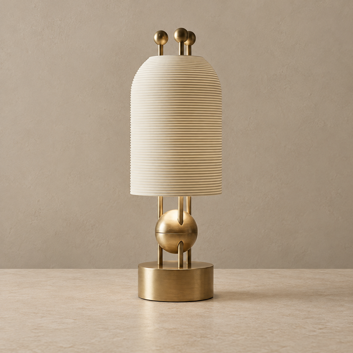 Brass table lamp with an unlit ribbed ivory ceramic shade.