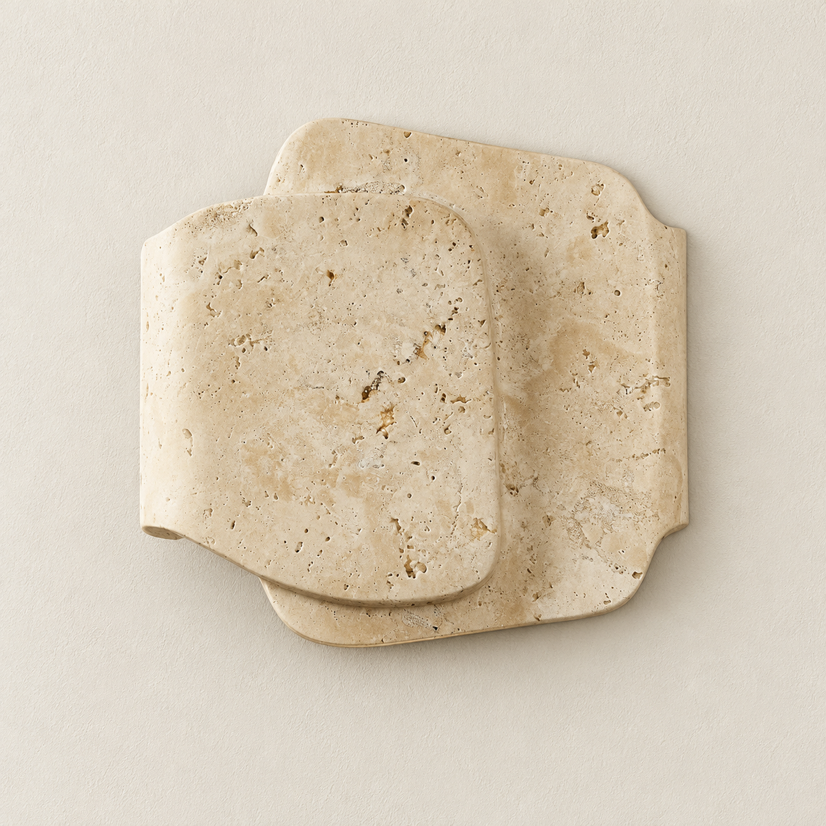 Layered travertine wall sconce with two curved stone panels, light off on ivory.