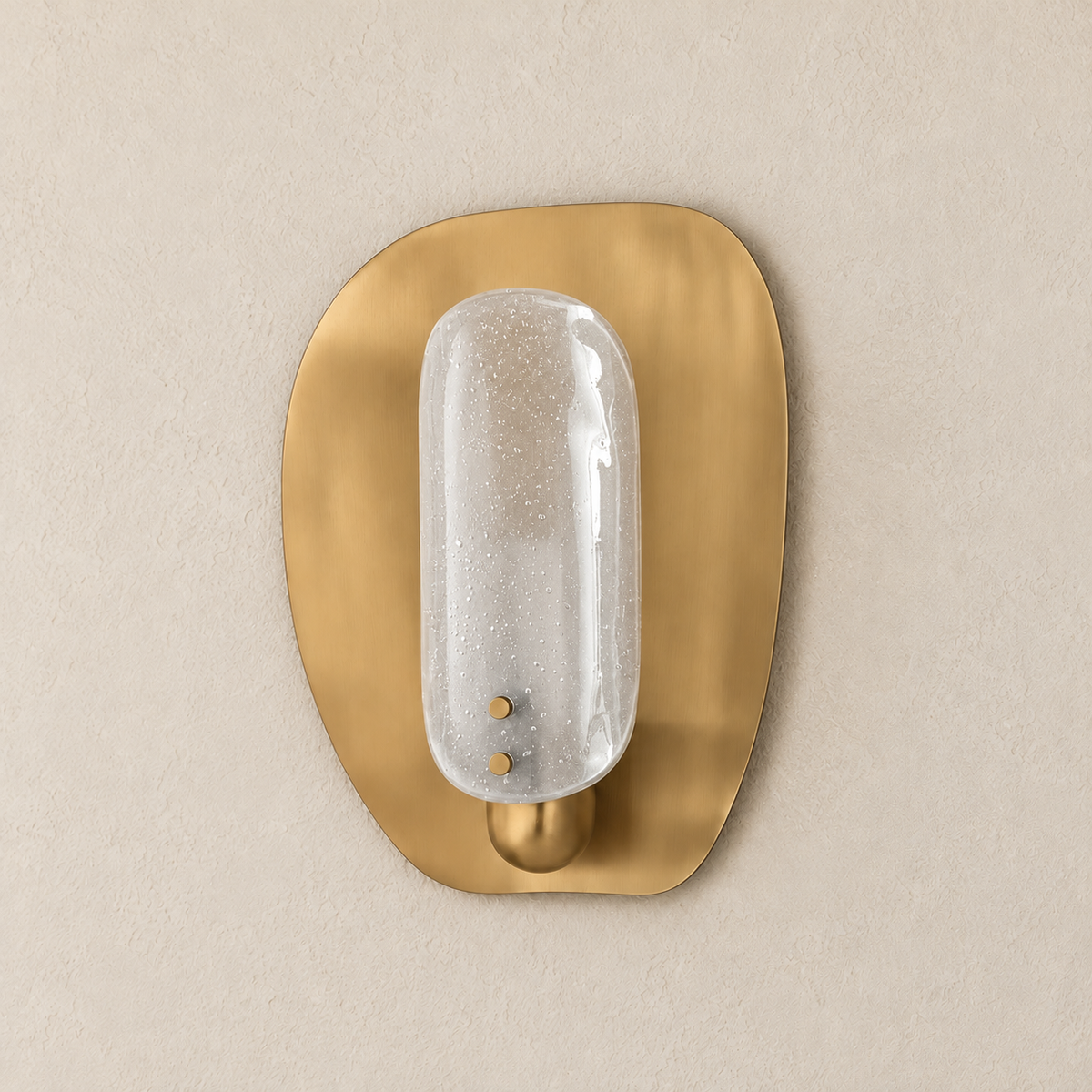 Angled view of the convex bubbled glass shade, brass pins and rounded backplate.