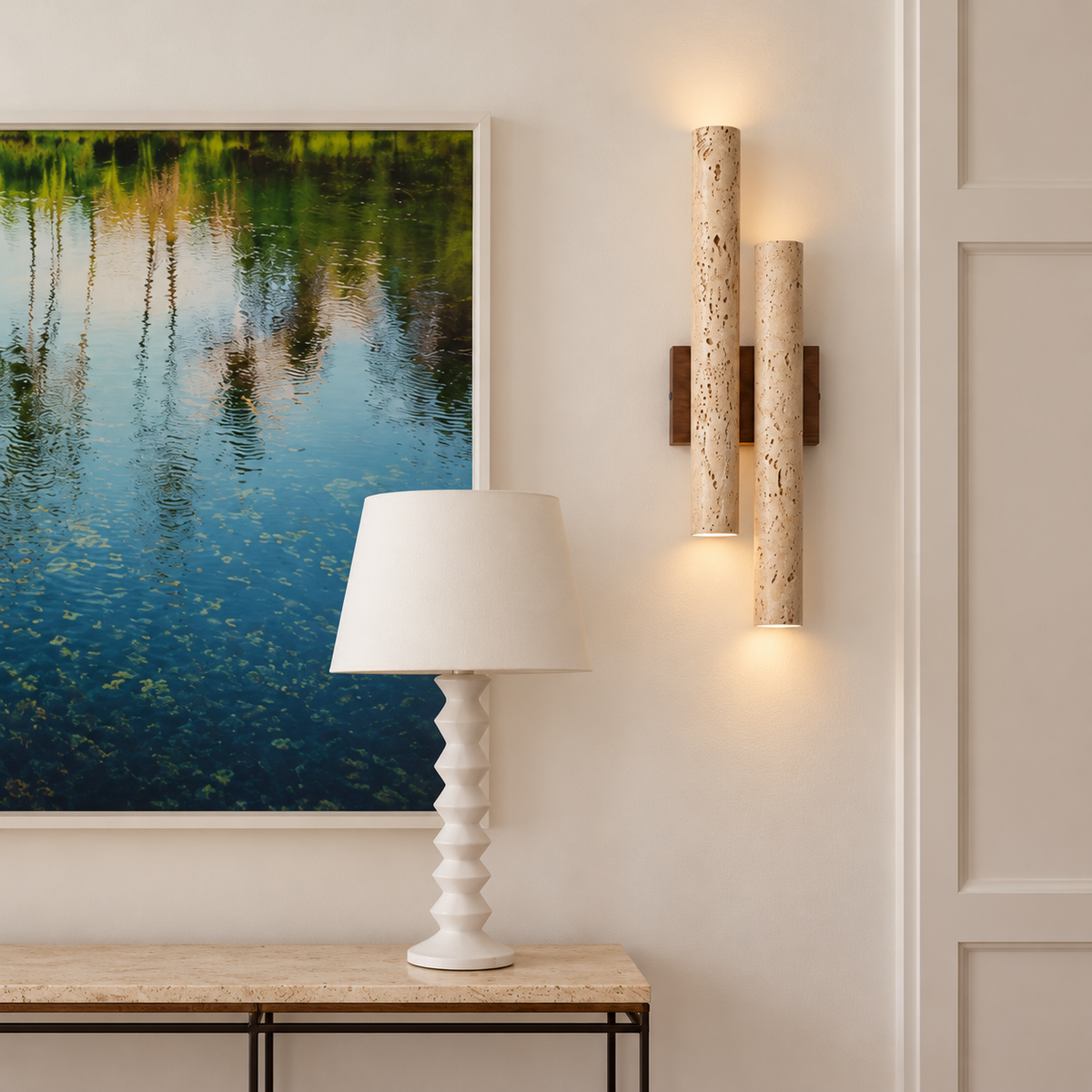 Double travertine and walnut wall sconce, installed above a console