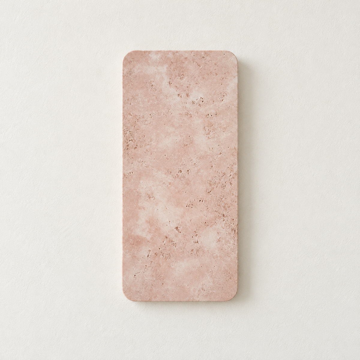 Unlit 65 cm pink marble wall lamp with rounded corners, viewed from the front on warm ivory.