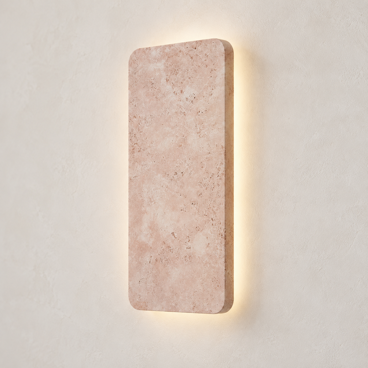 Angled view of the pink marble wall lamp showing its rounded edge, shallow profile and soft backlight.