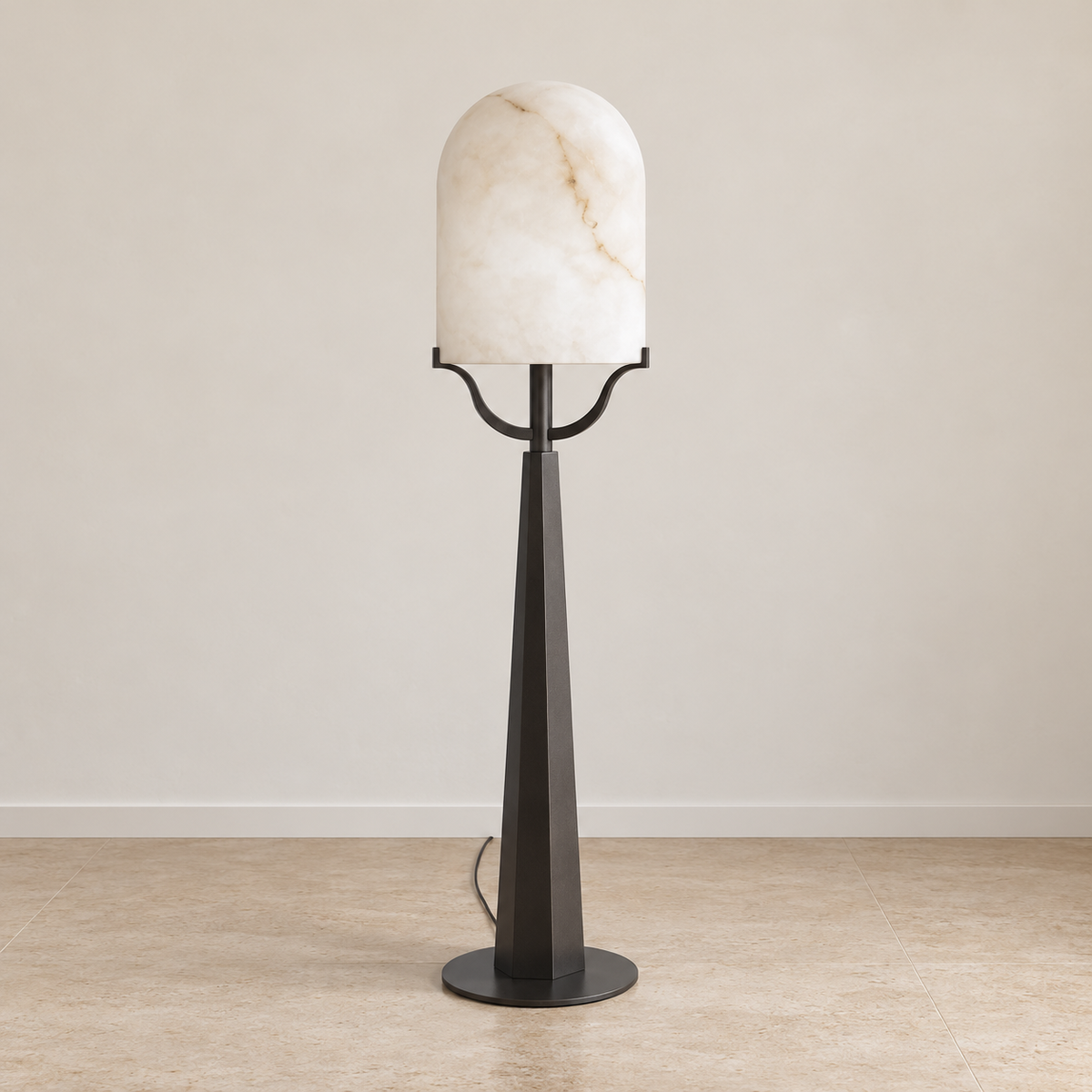 Front view of the Svolti alabaster floor lamp and its curved iron shade supports.