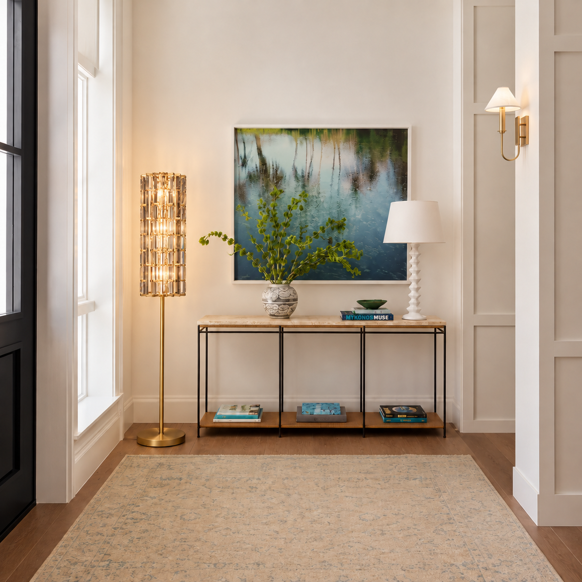 Illuminated crystal floor lamp beside a console in a bright panelled entrance.